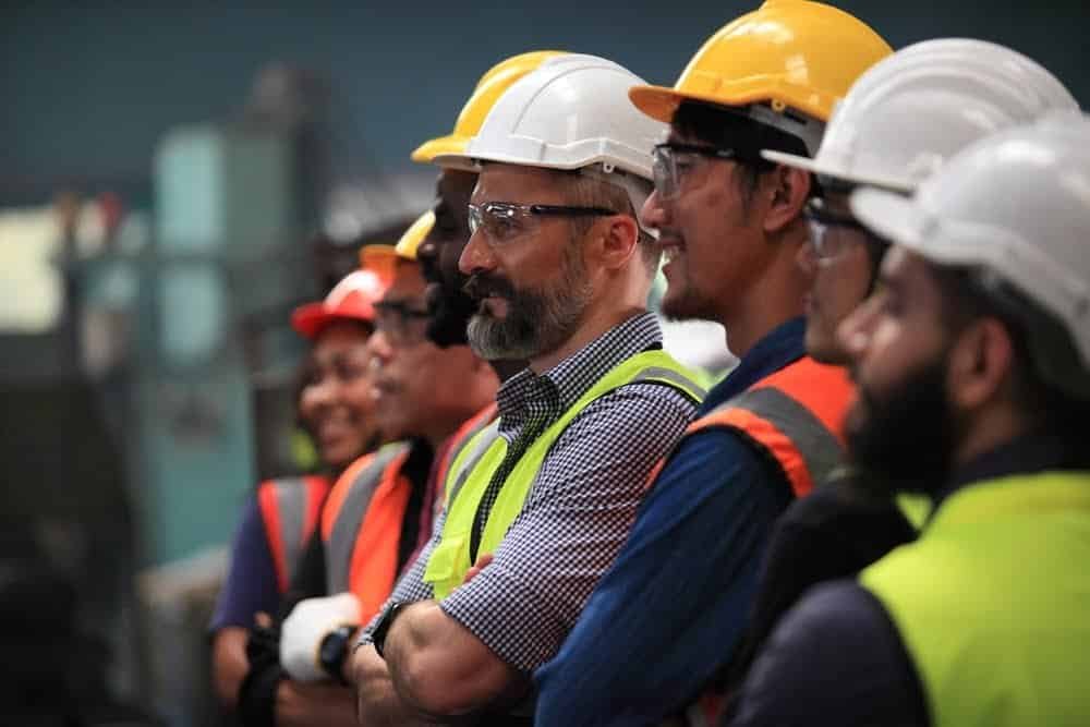 a group of people wearing hard hats