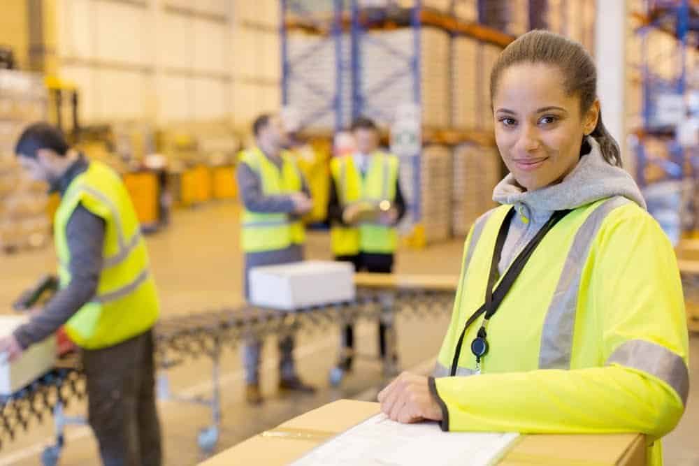 female performing 5S audit in warehouse